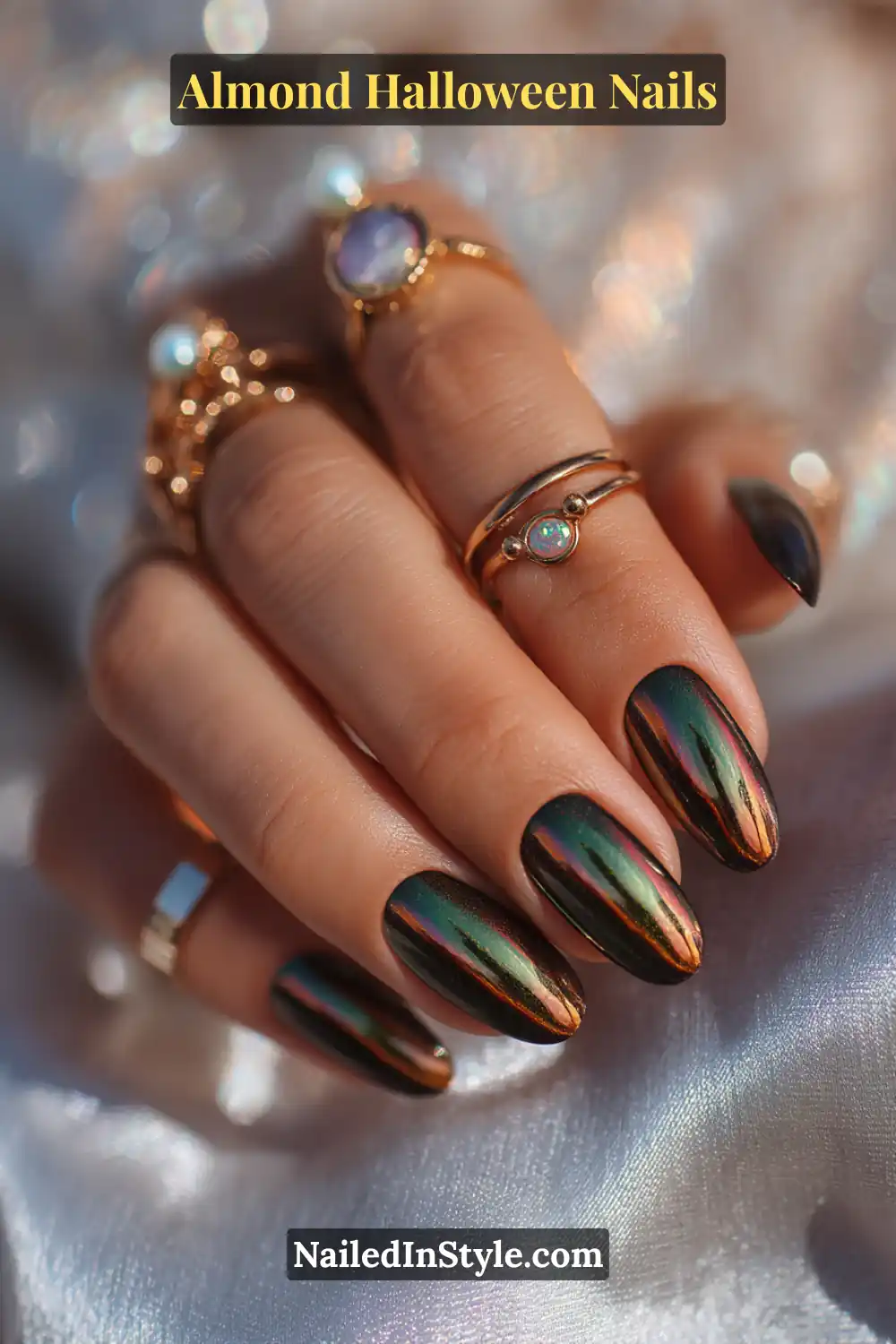 Close-up almond nails with multichrome magnetic pigment creating a diagonal glowing streak in green, copper, and violet hues, high-shine finish, Almond Halloween Nails.