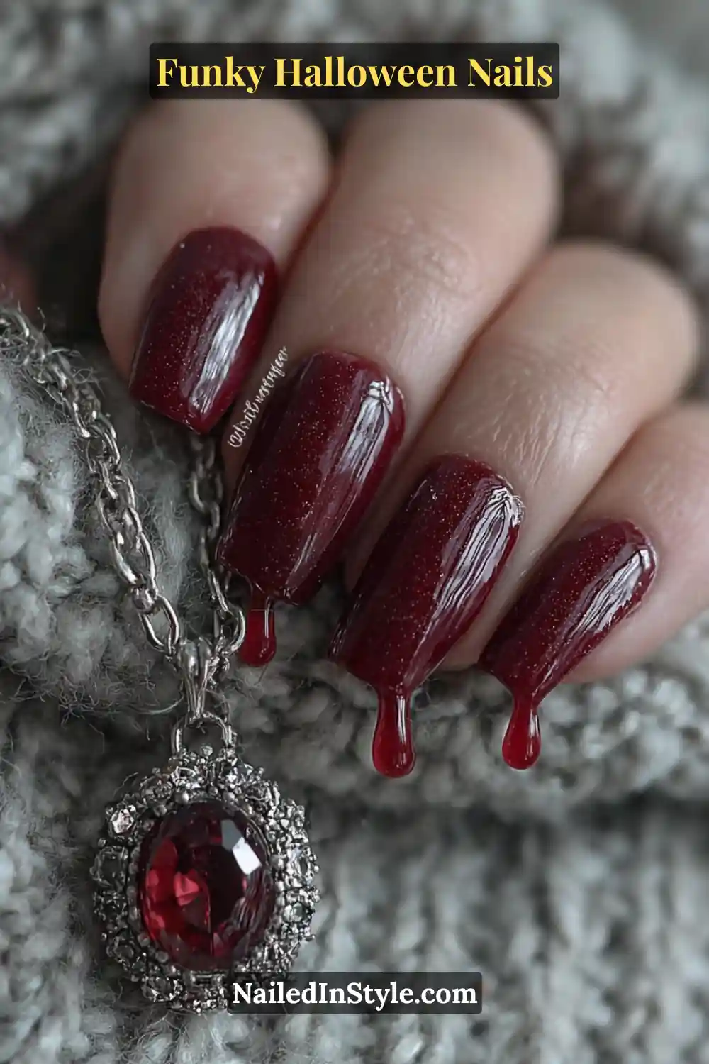 Medium coffin nails in crimson, ruby, and rose quartz shades featuring glossy 3D resin drips over a deep red base, styled with a ruby pendant for a dramatic Halloween allure.