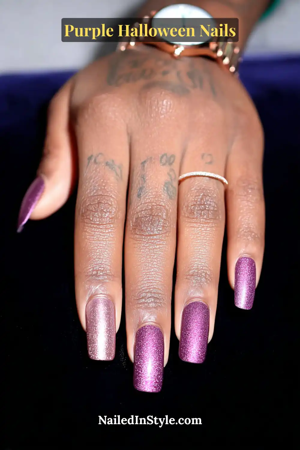 Long coffin nails painted in luminous plum with micro rose-gold shimmer, creating a rich, glowing finish that flatters medium to deep skin tones with a soft metallic warmth.