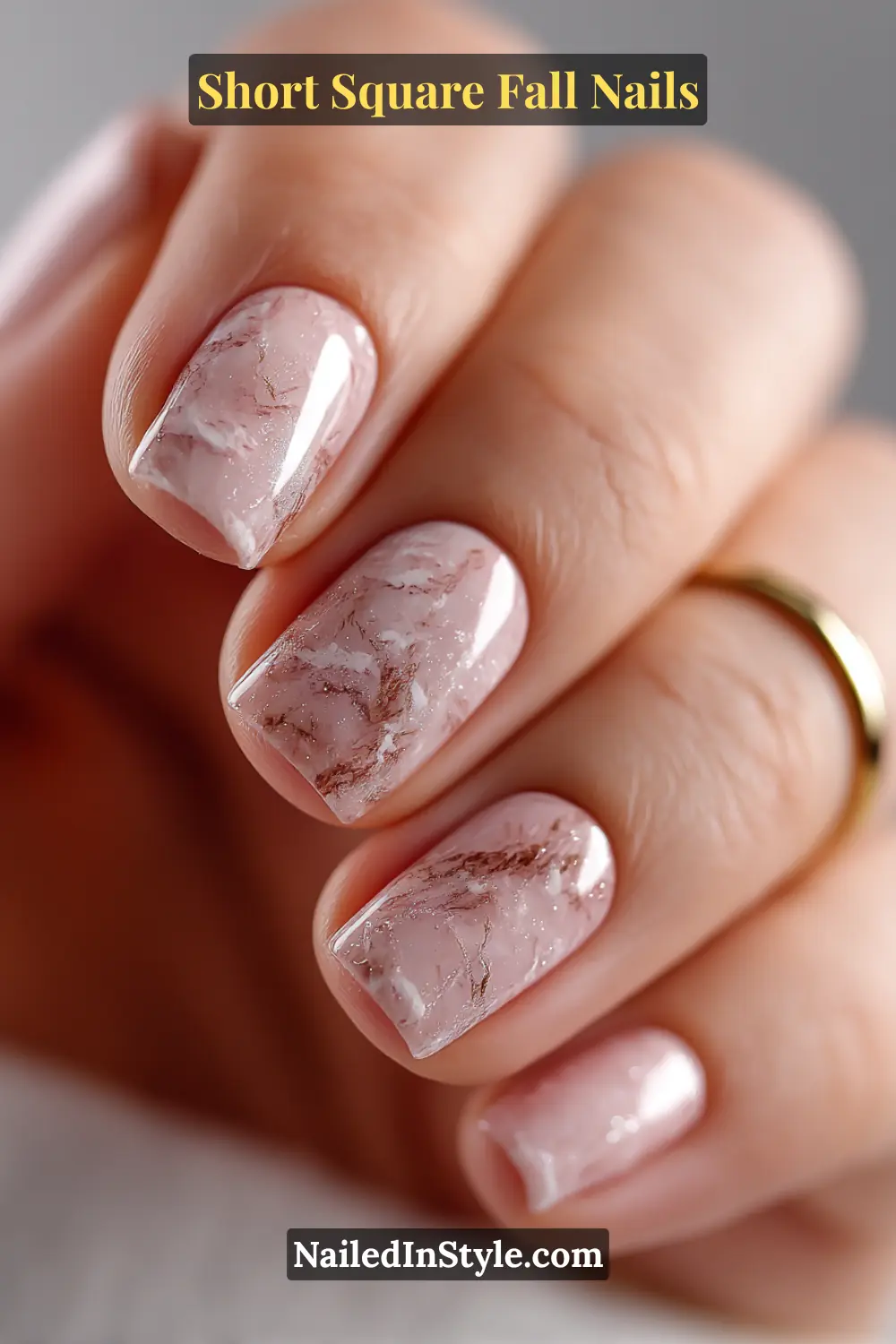 Short square nails in sheer fig with delicate smoke and ivory marble veins, giving a natural stone-like elegance that complements cozy autumn neutrals.