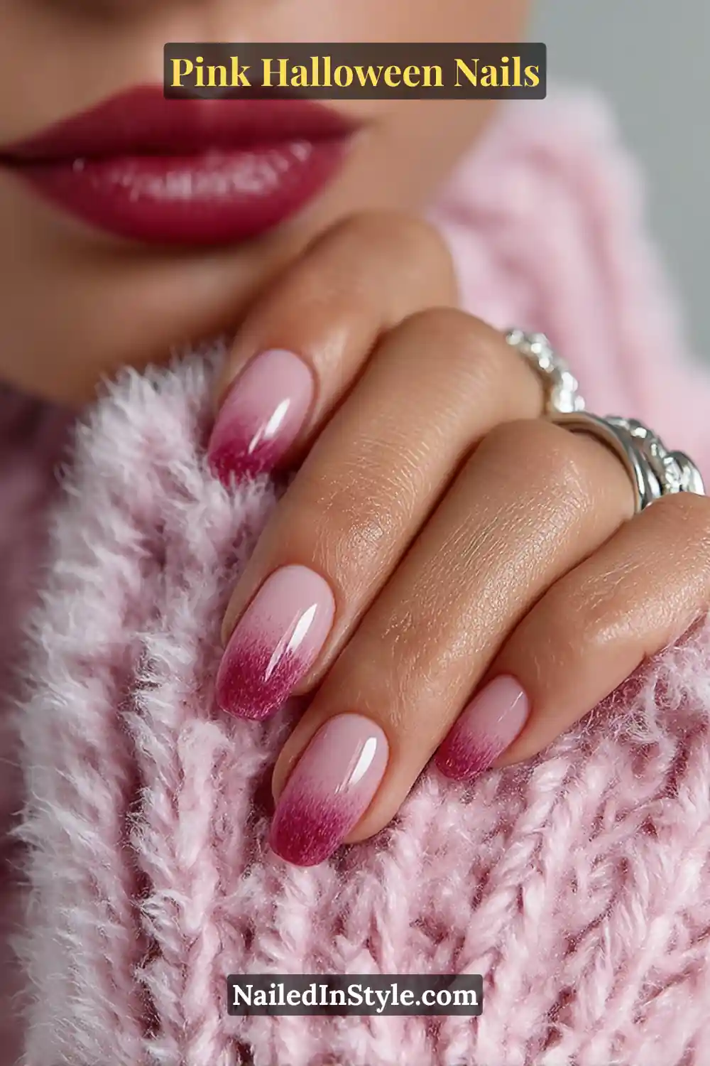 Pink Halloween nails with a deep fuchsia-to-charcoal smoky gradient and a glossy finish on long soft coffin nails, styled with silver rings and a berry lip look.