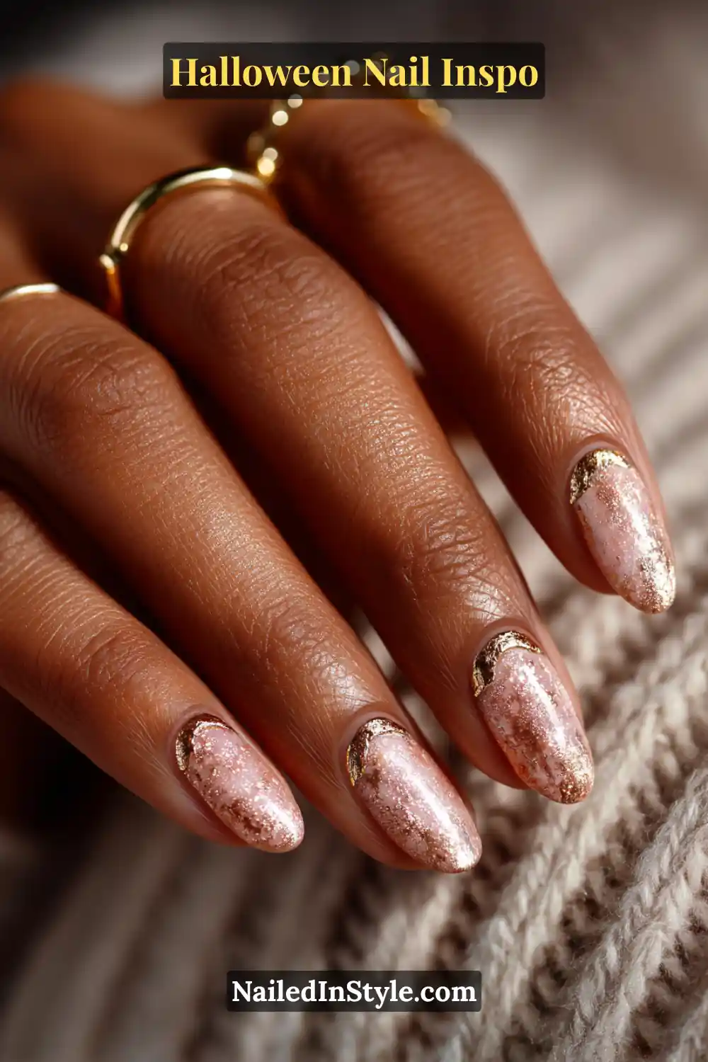 Medium squoval nails in creamy taupe with a 3D raised antique gold crescent at the cuticle, adding elegant Halloween warmth and dimension.