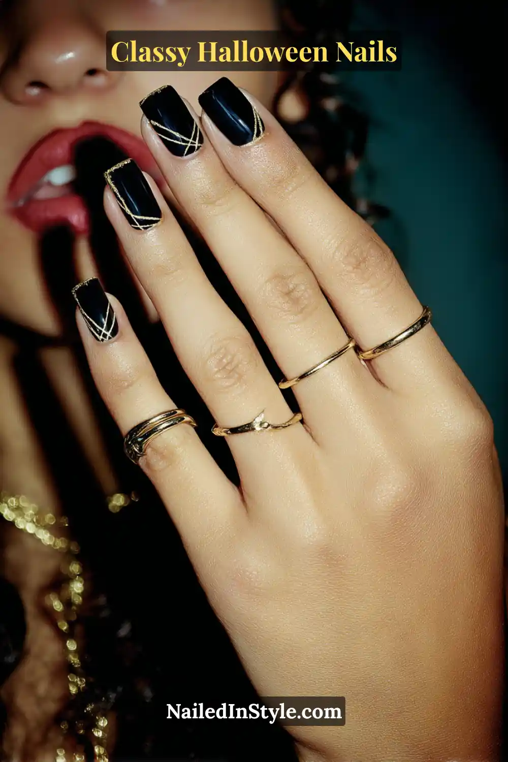 Short squoval nails painted in deep jet black with fine antique-gold metallic web lines tucked neatly into one corner, sealed in high gloss — a chic and subtle nod to Halloween opulence.