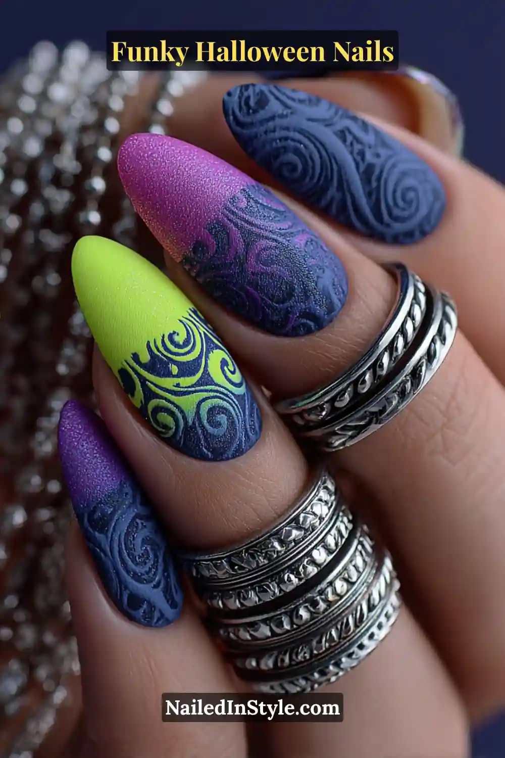 Medium almond nails painted in lime, violet, and obsidian hues with 3D glow-in-the-dark swirl patterns and micro-chrome shimmer detailing, creating a playful yet high-fashion Halloween statement.