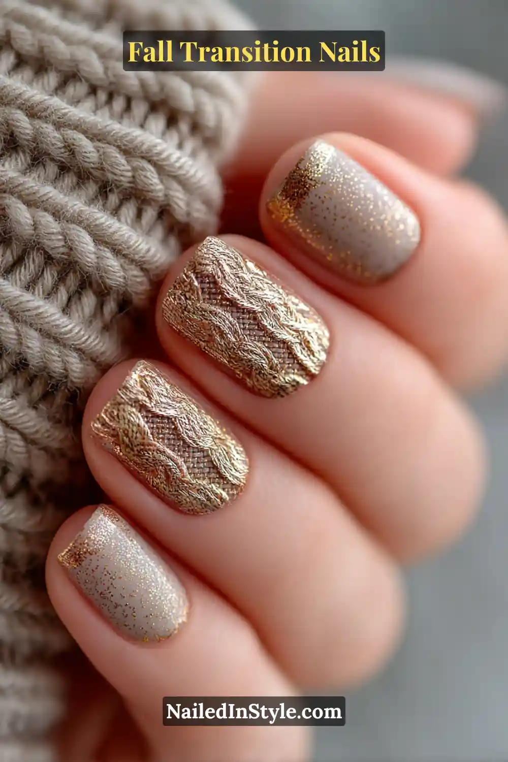 Short square nails featuring taupe and wheat tones with intricate golden thread textures across a matte base, styled beside a cozy knit sleeve.