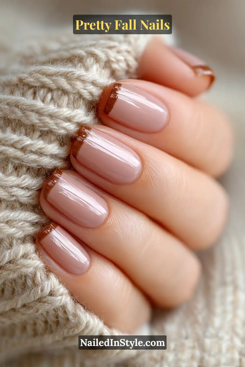 Short square nails painted in a cozy latte-oat tone with a soft velvet matte base and slender glossy cocoa micro-French tips, styled against a chunky knit sweater for a warm autumn mood.