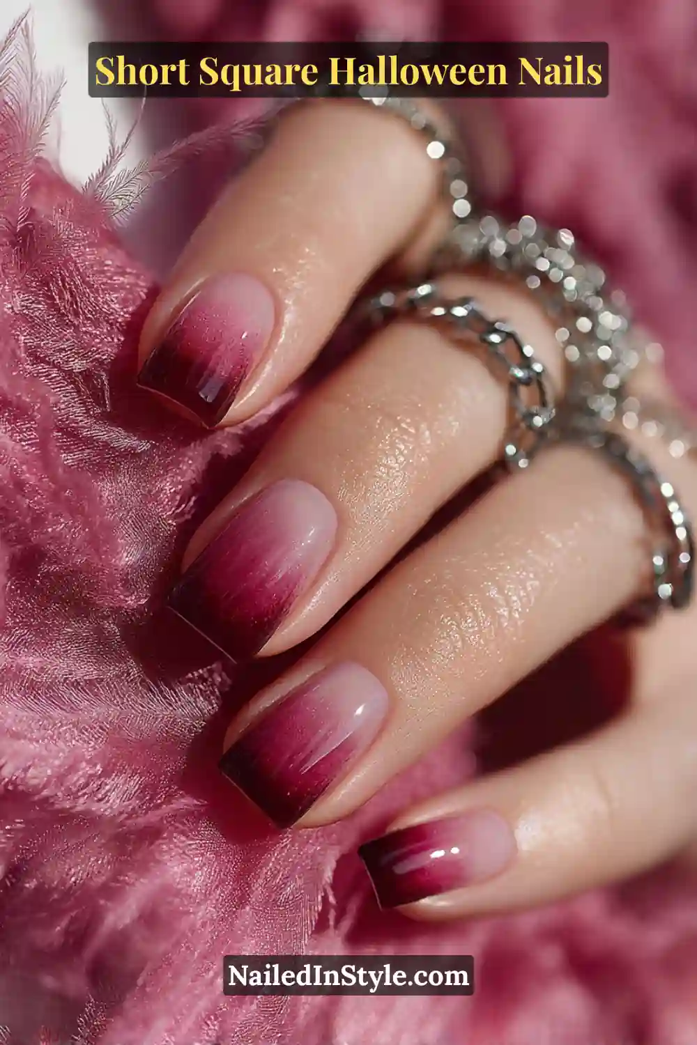 Short square nails with a magenta-to-charcoal gradient and glossy finish, creating a soft smoky ombré Halloween nail design.