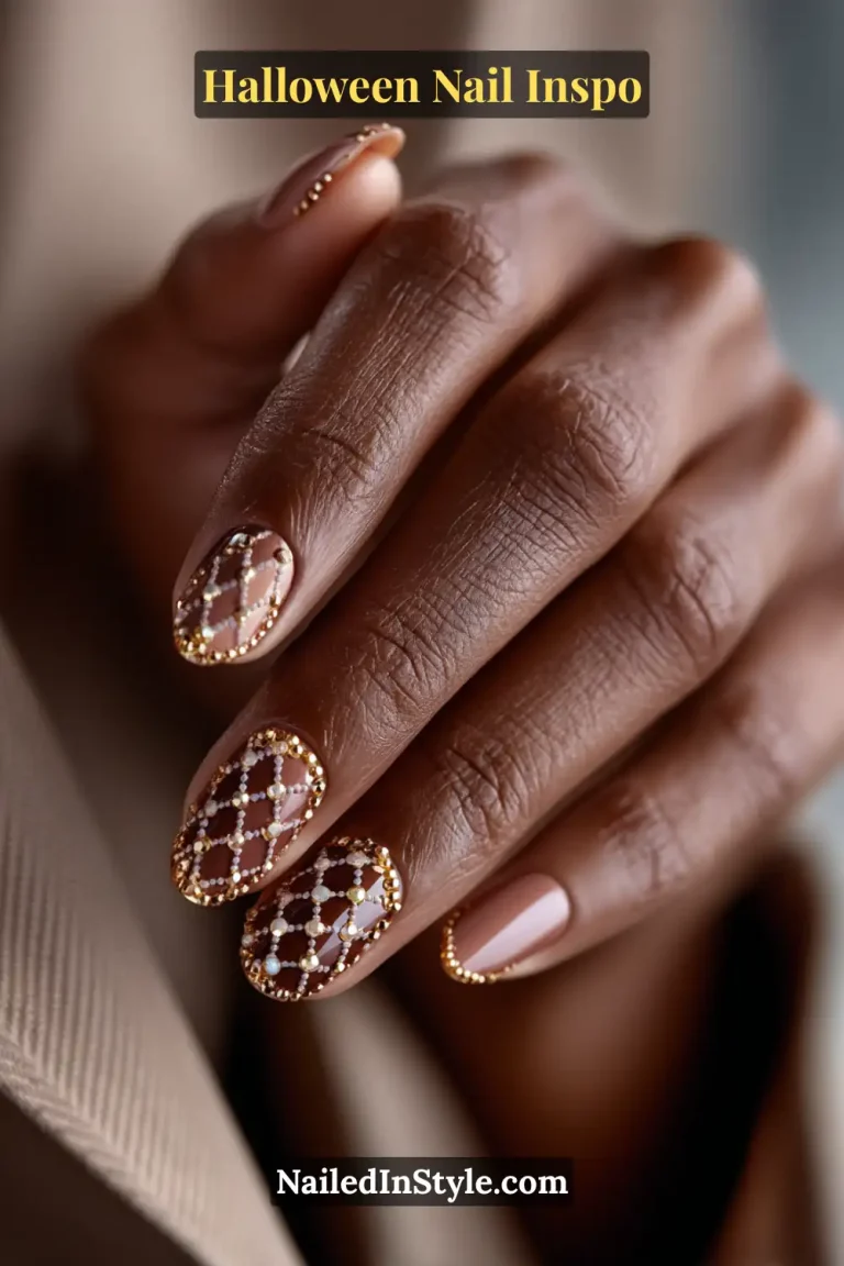 Short round nails in maple and sienna tones featuring a gold micro-bead lattice cuff design that adds warmth and refined texture for Halloween.
