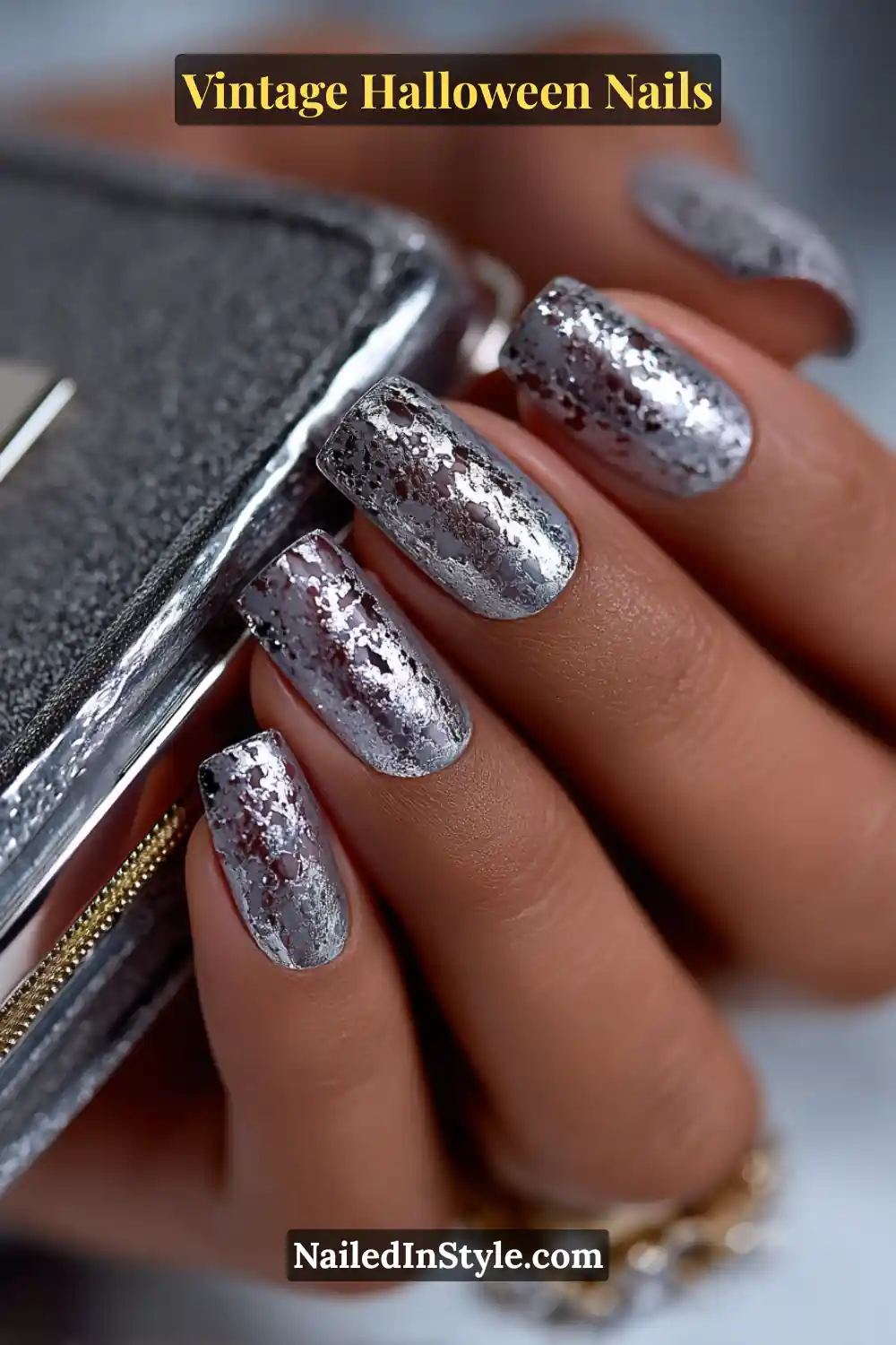 Medium square nails in pewter and silver with scattered reflective mirror flecks, creating a 3D mercury-glass texture that gleams beautifully under evening light.