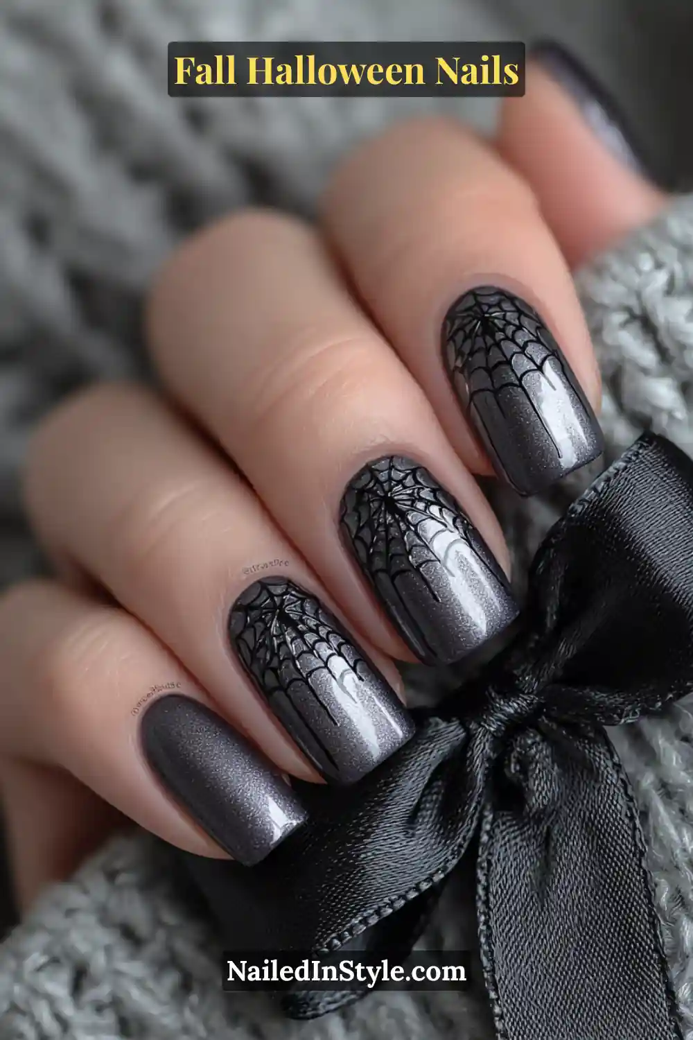 Short square nails with a deep midnight base and delicate black spiderweb French tips, styled beside a black satin bow for a refined yet moody fall aesthetic.