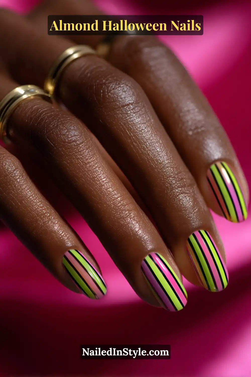 Close-up almond nails with vertical fluorescent lime and magenta stripes outlined by thin black halo lines, glossy finish under bright light, Almond Halloween Nails.