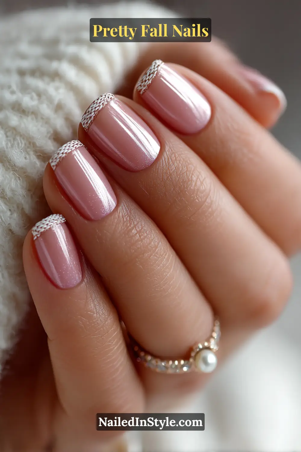 Short square nails with a satin porcelain base and delicate knit-textured half-moon edges in oatmeal and pewter, creating a soft, cozy contrast that flatters fair to medium skin tones.