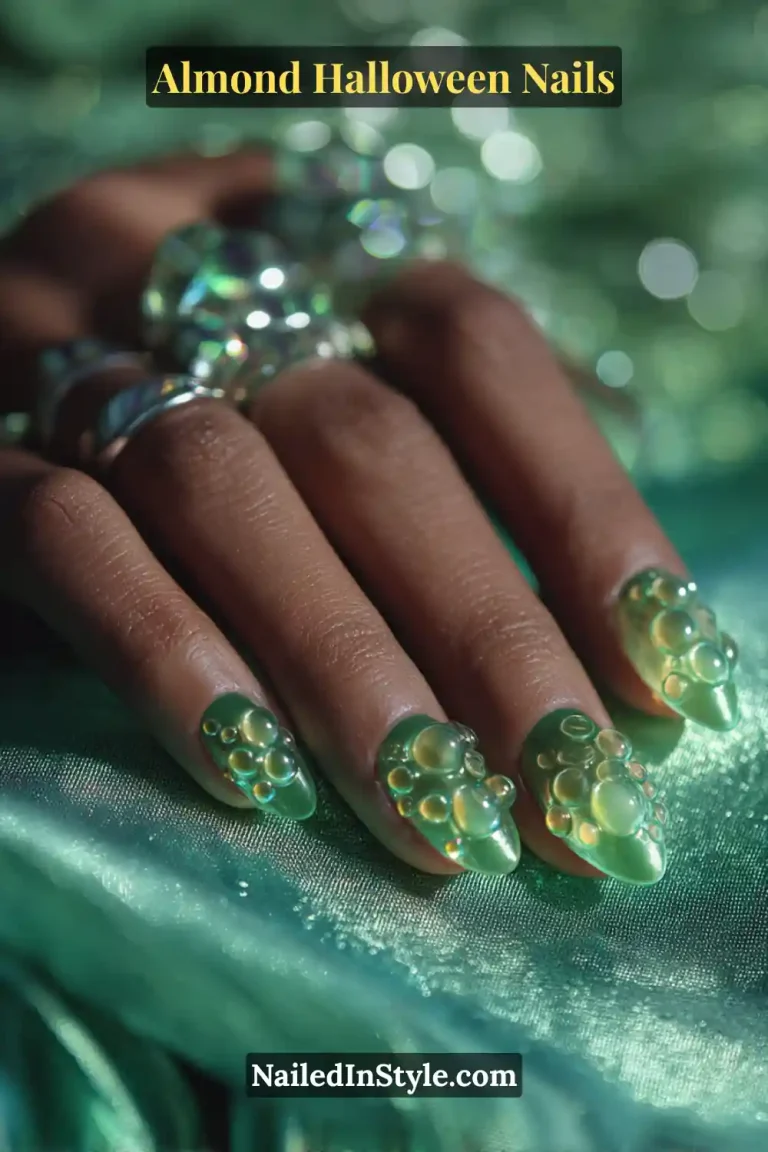 Close-up almond nails with translucent green acrylic base and raised 3D bubble domes resembling potion droplets, high-gloss sculpted finish, Almond Halloween Nails.