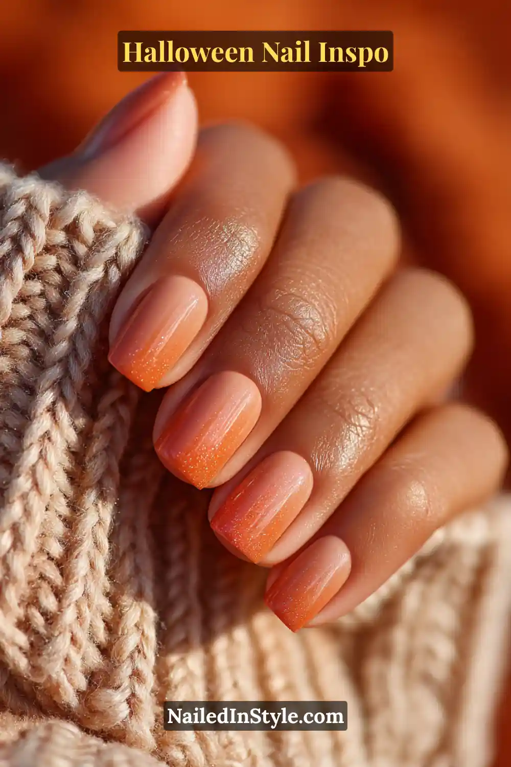 Medium square nails in soft pumpkin and latte tones with an airbrushed halo fade, glowing warmly for a cozy Halloween-inspired look.