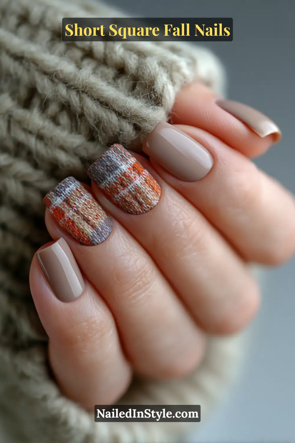 Short square nails in taupe with soft plaid tips in pumpkin orange and charcoal, adding cozy fall texture reminiscent of flannel fabric.