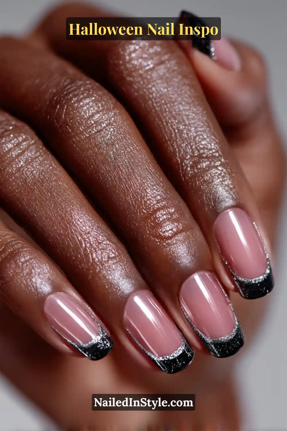 Long ballerina nails with jet-black off-center ribbon French tips outlined in silver shimmer, creating a chic, Halloween-ready twist on the classic French look.