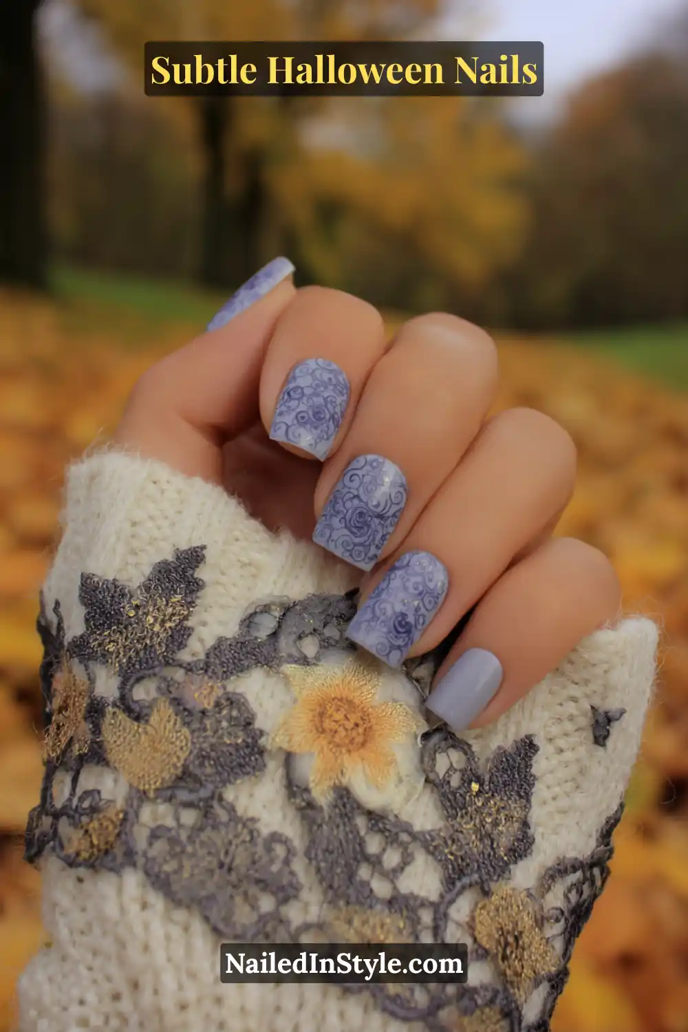 Medium almond nails with a semi-sheer lilac-gray base delicately stamped with smoky lace patterns, creating a veil-like shadow effect. Paired with an embroidered sleeve for a soft, romantic Halloween vibe with vintage undertones.