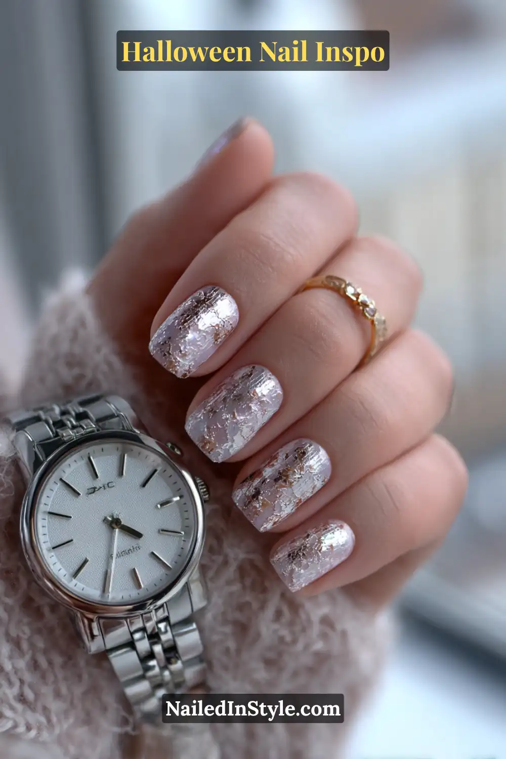 Short square nails with a soft pearl base and silver lace-mesh overlay, giving a refined metallic shimmer perfect for elegant Halloween looks.