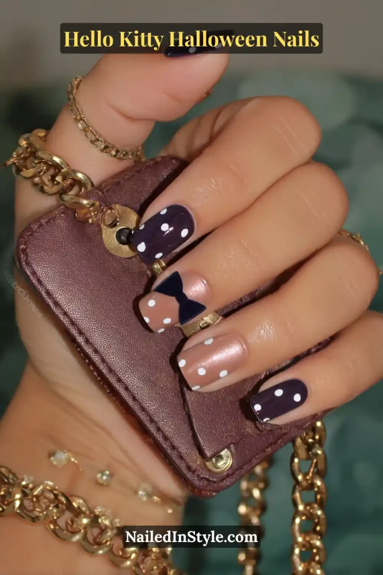Short squoval nails in mauve and rose gold tones with matte finish, detailed by tiny 3D velvet bows at the corners for a luxe, playful accent. Styled with a gold chain bracelet for a chic Hello Kitty Halloween vibe.