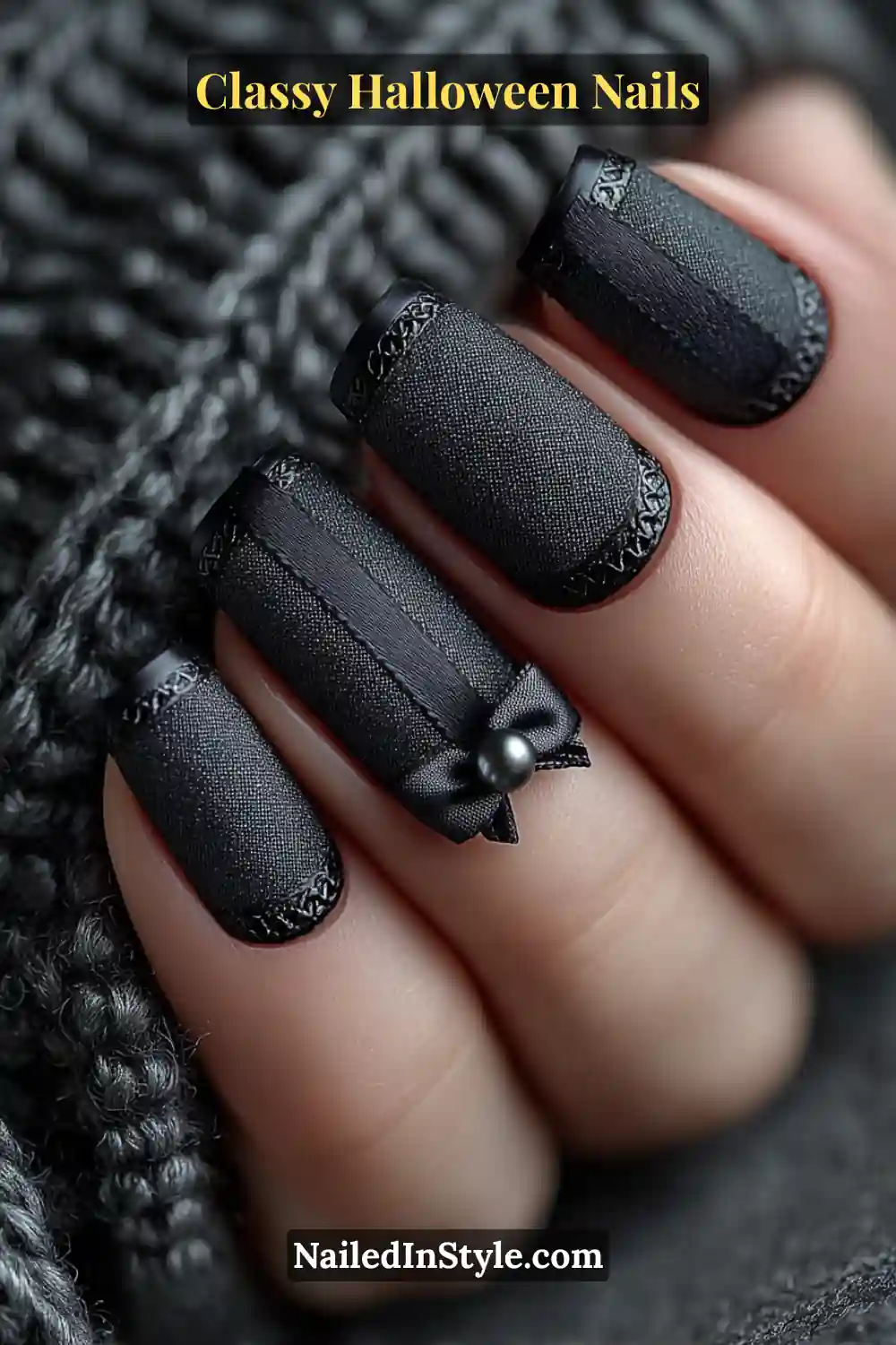 Classy Halloween Nails  Short square nails in deep raven black with a velvet matte texture and glossy ribbon micro-French edges, finished with a 3D bow stud and pearl accent — the perfect couture touch for a vintage Halloween mood.