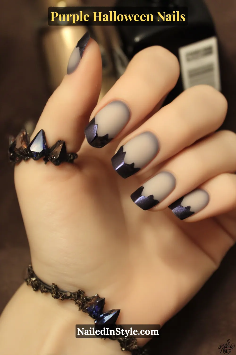 Short square nails in violet matte with chrome angular corners, creating a sculpted 3D mirror effect for a futuristic Halloween vibe.