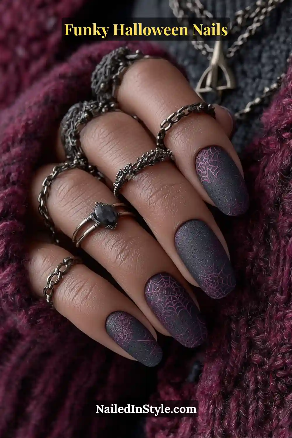Medium oval nails in raven, plum, and bronze tones with a soft velvet matte finish and fine metallic web overlays, styled with bronze jewelry for a spellbinding Halloween allure.