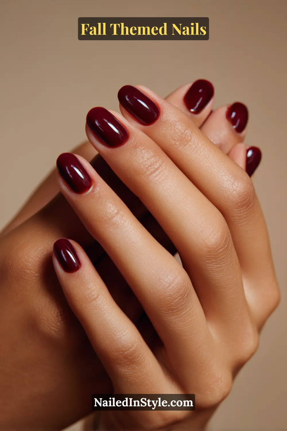 Fall Themed Nails Short oval fall nails in oxblood syrup sheer polish with layered wine-stain effect, glossy finish.