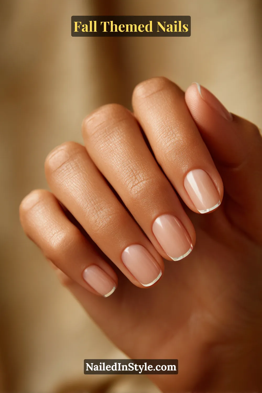Short square fall nails with creamy beige base and slim pewter chrome French tips, luxe minimal style.